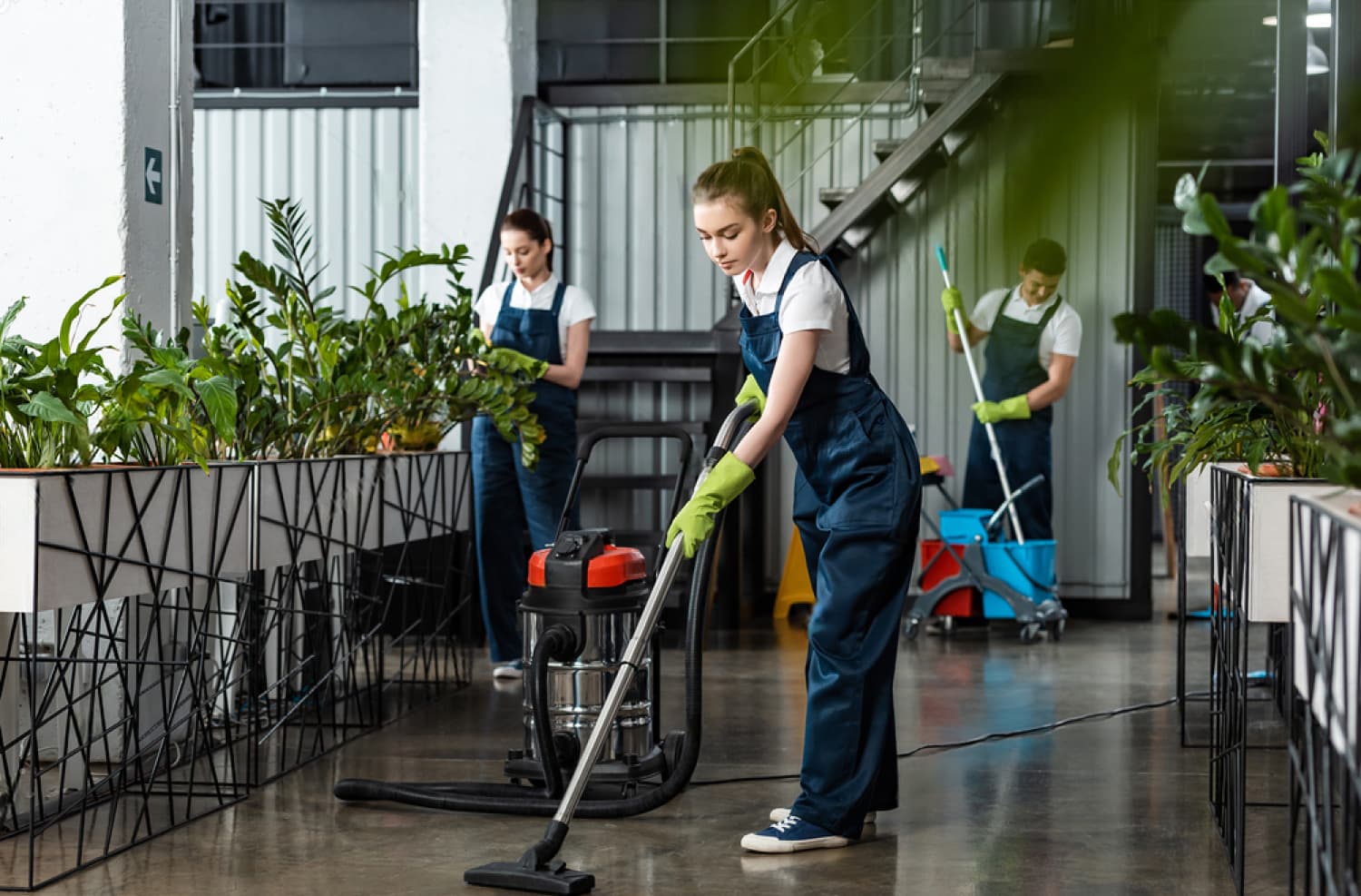 Clean modern office with cleaning professional